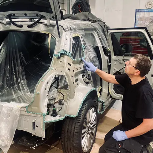 Technician carrying out structural bodywork repairs